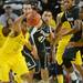 Michigan sophomore Trey Burke reaches after the ball in the second half against Michigan State at Crisler Center on Sunday, March 3, 2013. Melanie Maxwell I AnnArbor.com